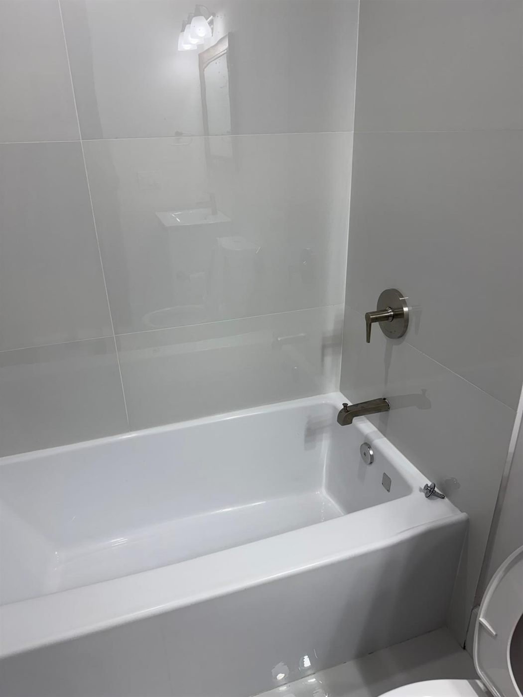 Gleaming white bathtub after a move-out cleaning